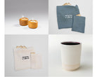 passover essentials set with tealight holders, kiddush cup, and linen matzah bag on a seder table